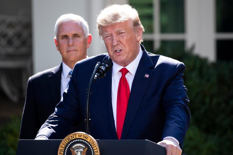 epa07803056 US President Donald J. Trump (R) delivers remarks beside US Vice President Mike Pence (L); at the establishment ceremony of the US Space Command in the Rose Garden of the White House in Washington, DC, USA, 29 August 2019. Space Command, which was established by the Air Force in 1985, is a division within the Defense Department that has been on a seventeen-year hiatus since being merged into the unified Strategic Command in 2002. Trump announced during the event that he would not proceed with a previously-planned trip to Poland, sending US Vice President Mike Pence on the trip instead as hurricane Dorian approaches Florida in the coming days.  EPA/MICHAEL REYNOLDS