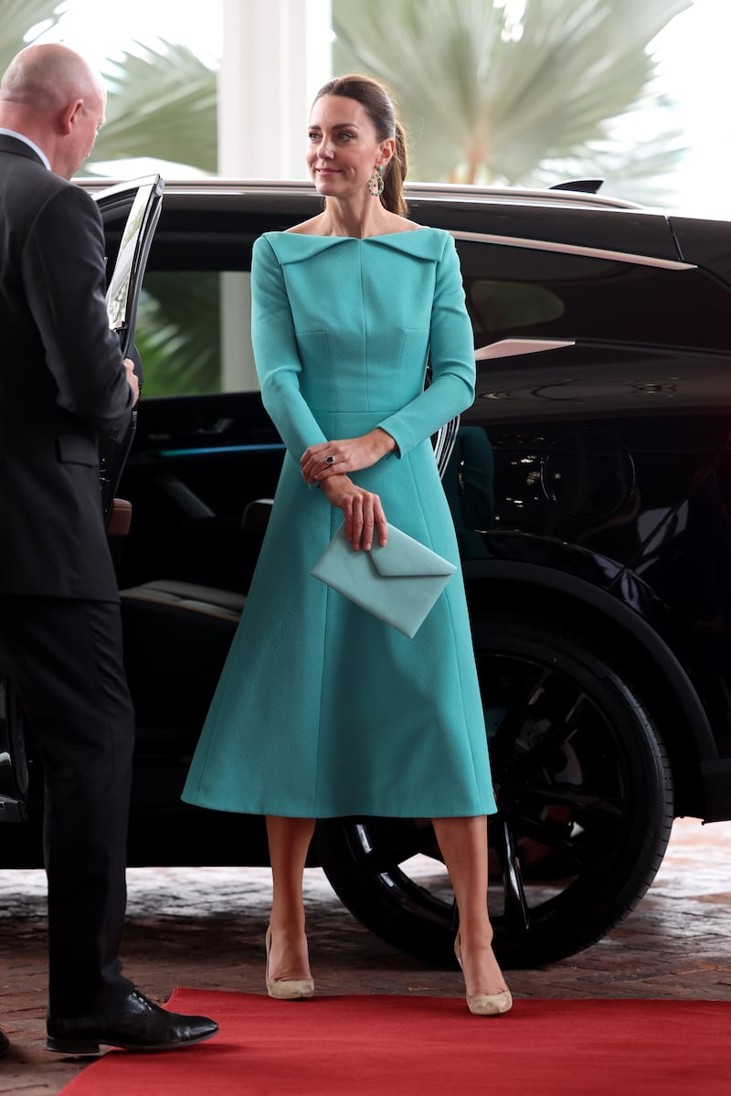The Duchess of Cambridge, wearing a tourquoise Emilia Wickstead dress, arrives for a private meeting with the Prime Minister of The Bahamas in Nassau on March 24. PA