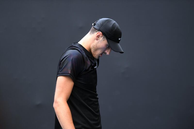 epa06437055 Bernard Tomic of Australia reacts against Lorenzo Sonego of Italy during qualifying round 3 for the Australian Open tennis tournament in Melbourne, Victoria, Australia, 14 January 2018. The Australian Open starts on 15 January.  EPA/JULIAN SMITH  AUSTRALIA AND NEW ZEALAND OUT