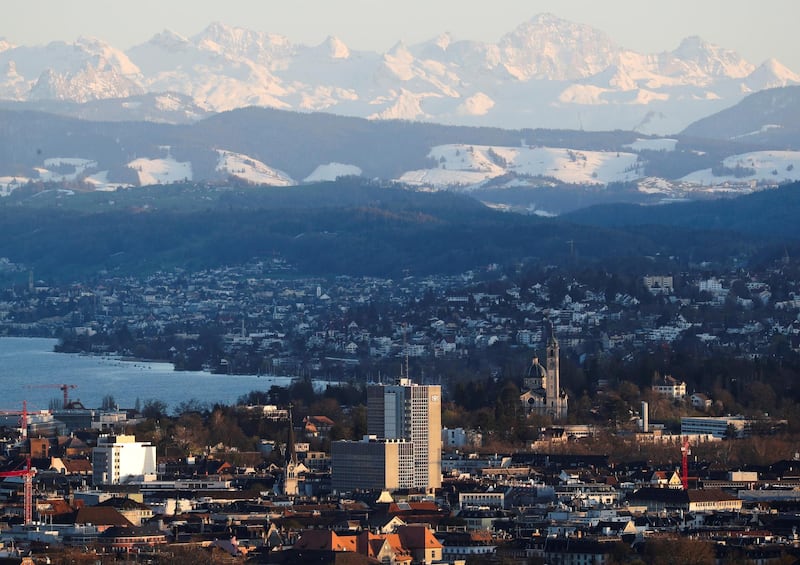 FILE PHOTO: The Verwaltungszentrum Werd administration center is seen in front of the eastern Swiss Alps and Lake Zurich in Zurich, Switzerland, April 8, 2021.  REUTERS/Arnd Wiegmann/File Photo