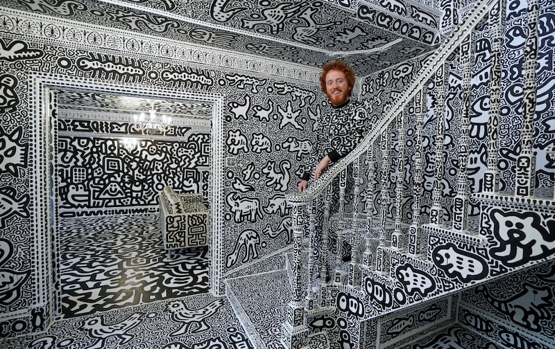 Cox has covered the entire mansion inside and out in his eye-catching, monochrome and cartoonish hand-drawn doodles.
