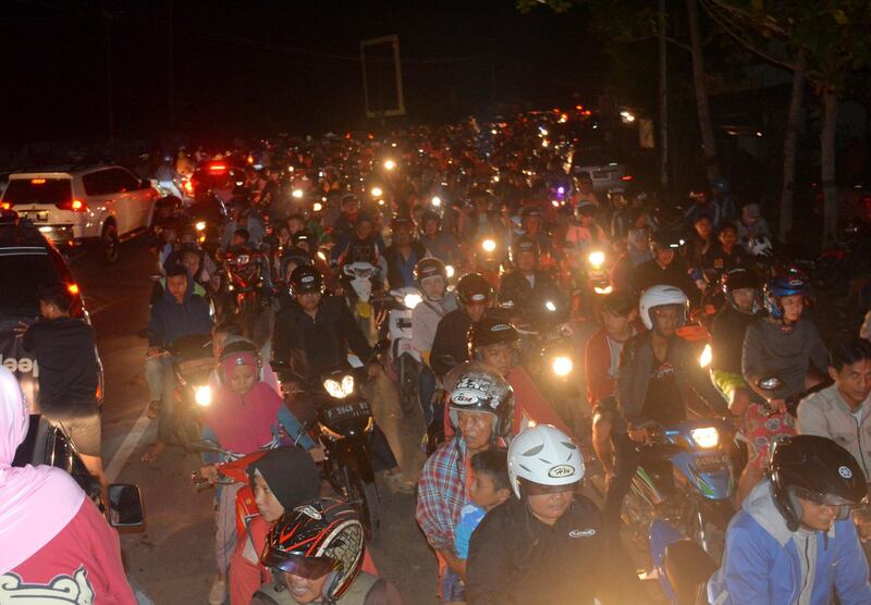 Motorists are stuck in traffic as they try to reach higher ground amid fears of a tsunami, following an earthquake in Cilacap, Central Java, Indonesia. Wagino / AP Photo