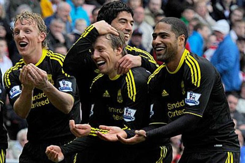 Suarez, in the back, congratulates Kuyt after the first goal.