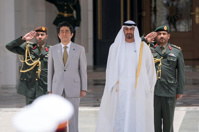 ABU DHABI, UNITED ARAB EMIRATES - April 30, 2018: HH Sheikh Mohamed bin Zayed Al Nahyan, Crown Prince of Abu Dhabi and Deputy Supreme Commander of the UAE Armed Forces (R) and HE Shinzo Abe, Prime Minister of Japan (L), stand for the national anthem during a reception at the Presidential Palace.

( Rashed Al Mansoori / Crown Prince Court - Abu Dhabi )
---