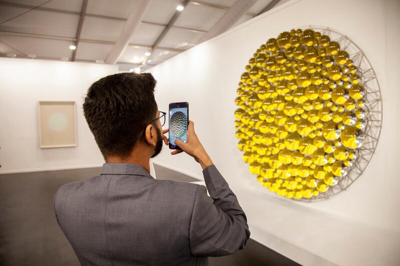 At this year's India Art Fair, Berlin gallery neugerriemschneider is presenting a work by Olafur Eliasson comprised of glass spheres that change colour as visitors walk around them. Courtesy India Art Fair 2020