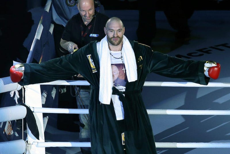 Tyson Fury celebrates his victory over Ukrainian heavyweight boxer Vladimir Klitschko before 45,000 at the Esprit Arena in Dusseldorf, Germany.  EPA/Friso Gentsch