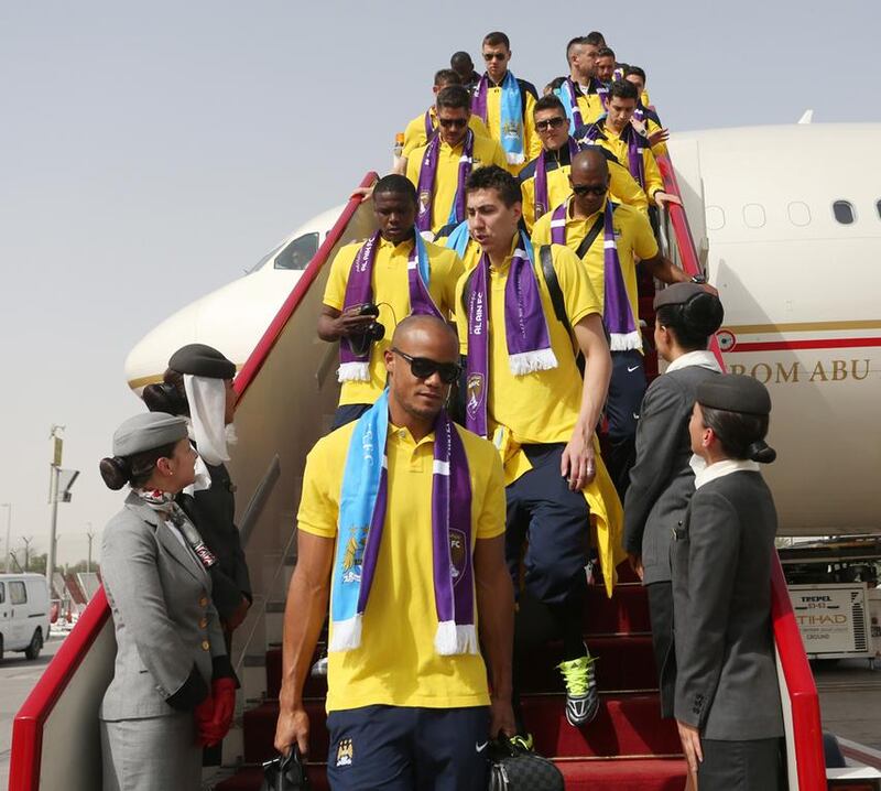 Manchester City captain Vincent Kompany leads the squad off their Etihad Airways flight after landing in Abu Dhabi. Photo Courtesy EAA 