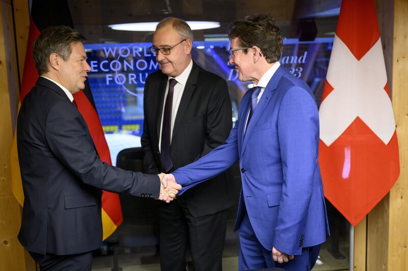 From left, German Vice Chancellor Robert Habeck with Swiss ministers Guy Parmelin and Albert Roesti before the start of a bilateral meeting in Davos. EPA