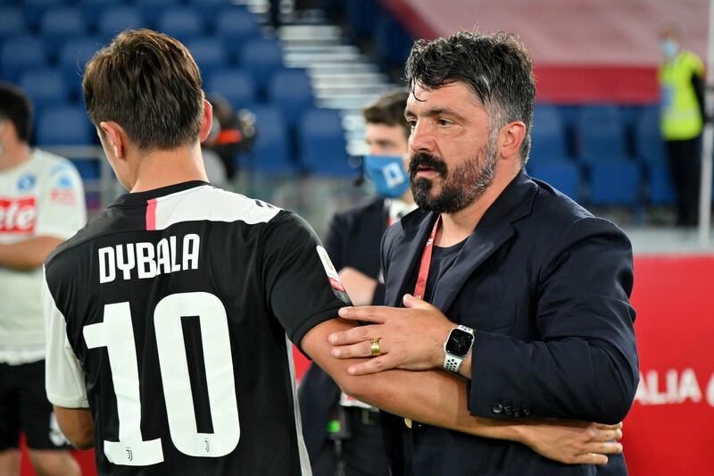 Napoli coach Gennaro Gattuso hugs Juventus star Paulo Dybala after the Coppa Italia Final. Getty
