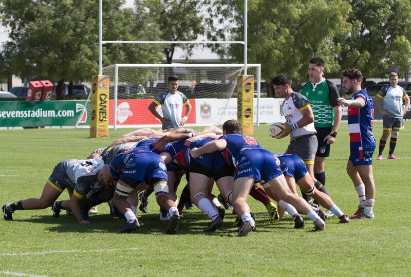 Dubai Hurricanes (grey/white shirts) take on Jebel Ali Dragons at The Sevens Stadium in Dubai. Ruel Pableo for The National