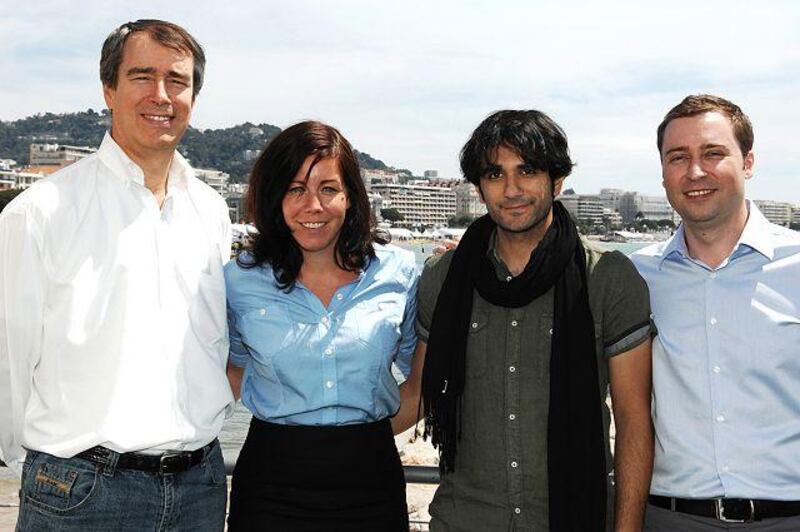 From left, Edward Borgerding, the chief executive of Imagenation Abu Dhabi, Daniela Tully of Imagenation, Nawaf al Janahi, the Sea Shadow director, and Stefan Brunner, also of Imagenation, at the Cannes Film Festival yesterday.