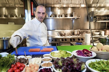 Chef Alessandro Montedoro, executive chef at Ritz Carlton Abu Dhabi, recommends adding a splash of water to an olive oil dressing to make it less heavy but no less tasty. Photo: Victor Besa / The National 