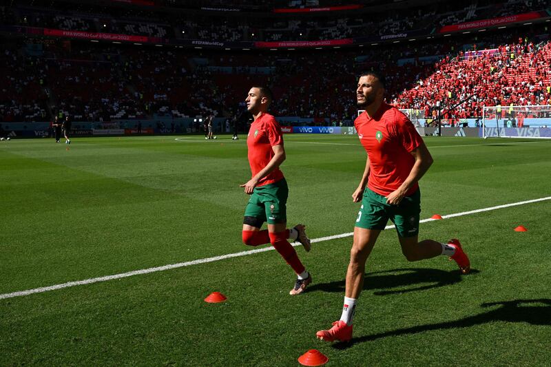 Morocco's Hakim Ziyech, left, and Romain Saiss warm up ahead of their World Cup Qatar 2022 Group F match against Croatia at the Al Bayt Stadium in Al Khor, north of Doha. AFP