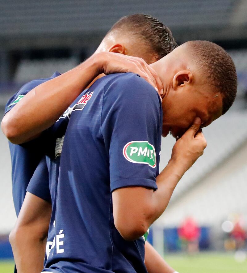 PSG's Kylian Mbappe in tears after his injury. AP
