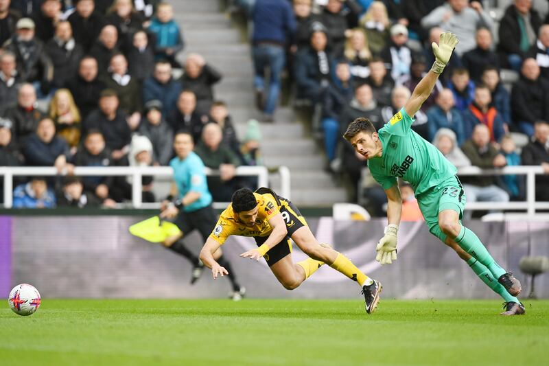 Wolves striker Raul Jimenez is brought down by Newcastle goalkeeper Nick Pope in the first half but no foul was given. Getty