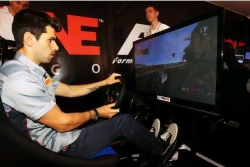 Jaime Alguersuari relieves his competitive nature at the Monaco Grand Prix's Fan Zone. The 22-year-old Spaniard has been working for Pirelli as their test driver this season and is confident he will be back in Formula One in 2013.