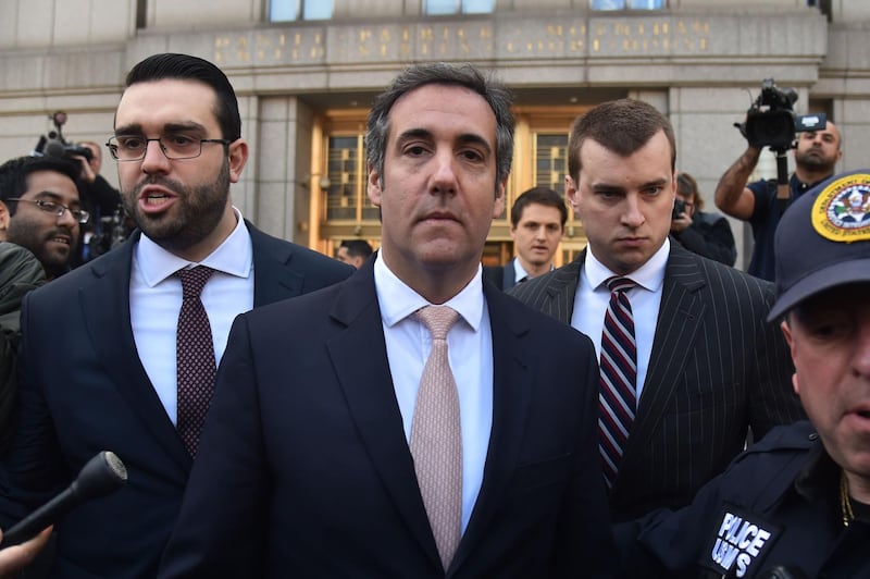 (FILES) In this file photo taken on April 26, 2018 US President Donald Trump's personal lawyer Michael Cohen (C) leaves the US Courthouse in New York. - Federal investigators are investigating whether President Donald Trump's former personal lawyer Michael Cohen committed bank and tax fraud exceeding $20 million via loans obtained by the taxi medallion business he owns with his family, The New York Times has reported.
The Times, in its report first published August 19, 2018, said investigators were also trying to determine whether Cohen violated campaign finance or other laws when he made deals using hush money to silence women who claimed they had affairs with Trump. (Photo by HECTOR RETAMAL / AFP)