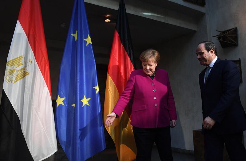 Angela Merkel poses with Abdel Fattah El Sisi. AFP