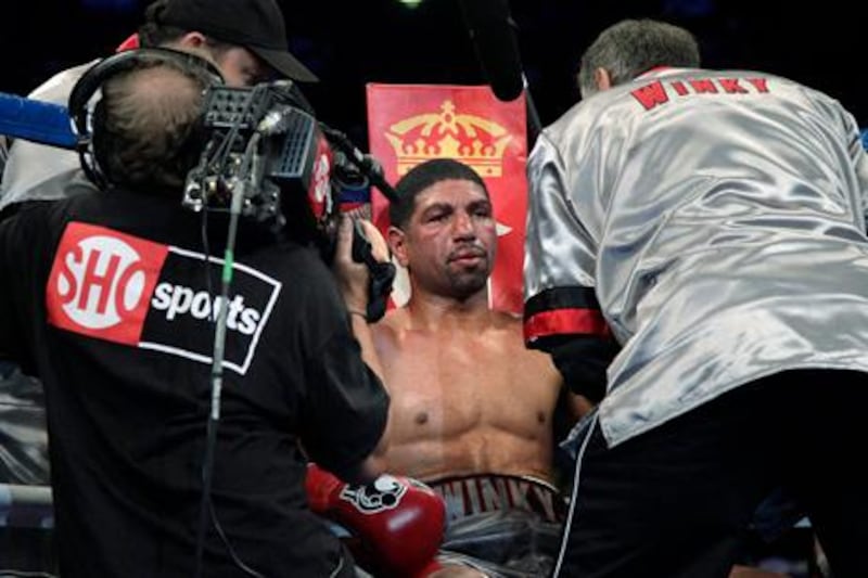 Winky Wright sits in his corner after the eighth round of a middleweight boxing match against Peter Quillin in Carson, Calif., Saturday, June 2, 2012. Quillin won by unanimous decision after the 10th round. (AP Photo/Jae C. Hong)