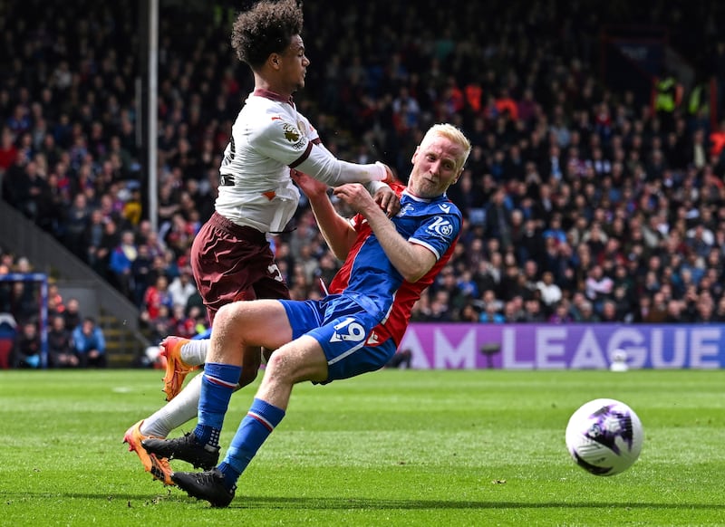 Manchester City's Norwegian midfielder Oscar Bobb fights for the ball with Crystal Palace midfielder Will Hughes. AFP