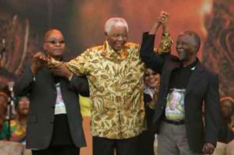 Thabo Mbeki, right, and Jacob Zuma, left, celebrate the 90th birthday of former South African president Nelson Mandela in August.
