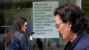 A sign from the artists and curators at the Venice Biennale announces they won't open the Israeli pavilion. AP