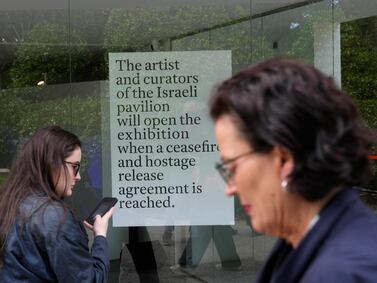 A sign from the artists and curators at the Venice Biennale announces they won't open the Israeli pavilion. AP