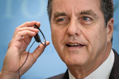 World Trade Organization (WTO) director-general Roberto Azevedo adjusts his earphone as he gives a press conference on April 12, 2018 at their headquarters in Geneva.
The World Trade Organization releases today its latest forecasts as trade tensions between the United States and China ratchet up. / AFP PHOTO / Fabrice COFFRINI