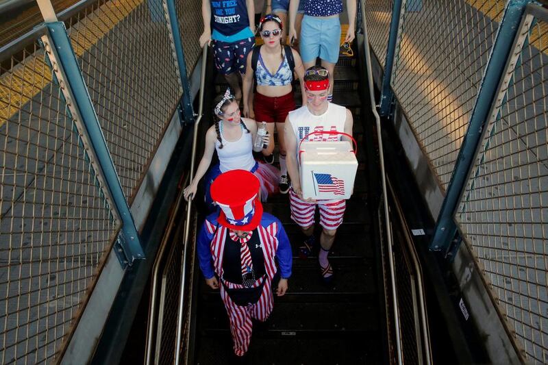 People arrive on the subway at Coney Island before the Nathan’s Famous Fourth of July International Hot Dog-Eating Contest. Andrew Kelly / Reuters