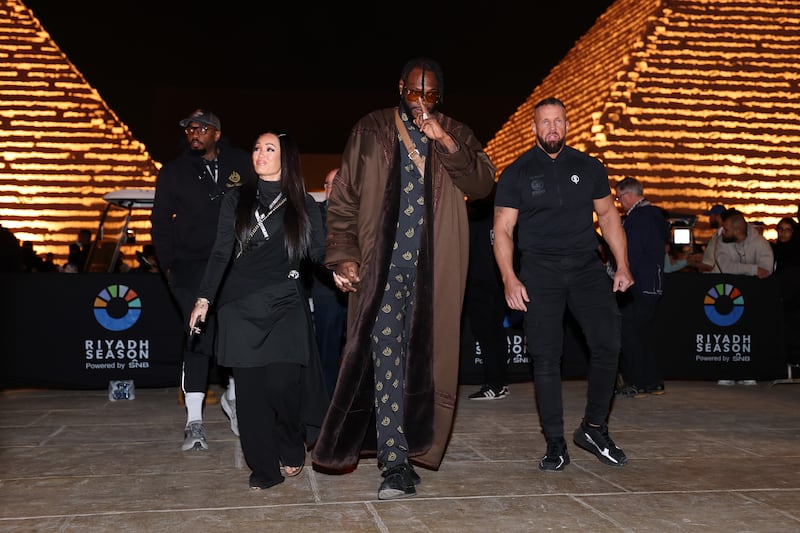 Deontay Wilder arrives with his fiancée, Telli Swift, ahead of the Day of Reckoning. Getty Images