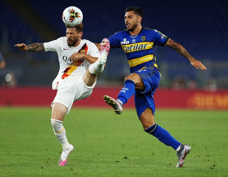 Carles Perez of AS Roma competes for the ball with Giuseppe Pezzella of Parma Calcio during the Serie A match between AS Roma and Parma Calcio at Stadio Olimpic in Rome, Italy. Getty Images