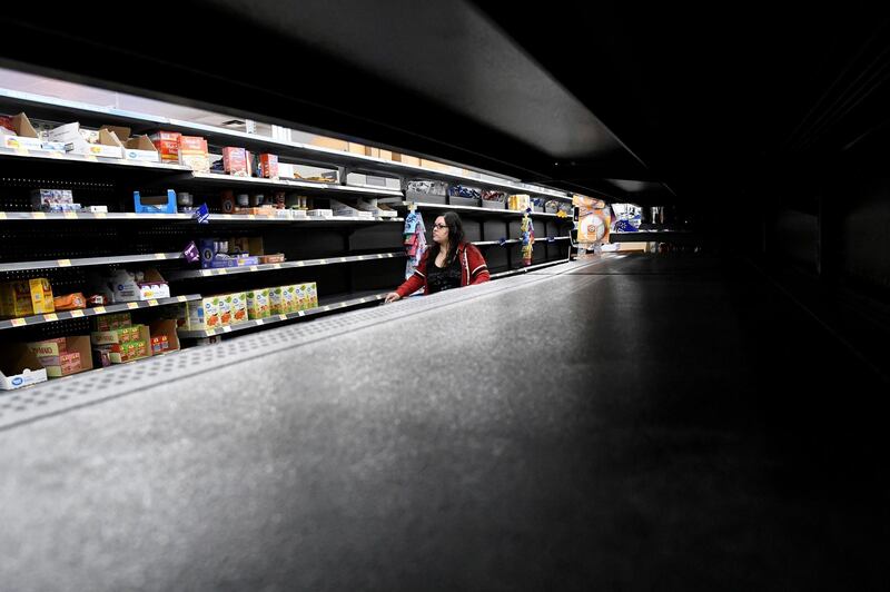Nina Roberts shops for last minute supplies while shelves remain empty as Hurricane Lane approaches Honolulu, Hawaii. Hugh Gentry / Reuters