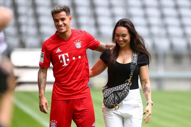 Bayern Munich's Philippe Coutinho poses with his wife, Aine Coutinho, during the presentation. Reuters