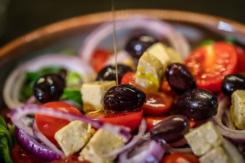 Olive oil goes on to a salad at a restaurant in Barcelona, Spain. Health researchers continue to find evidence in favour of olive oil and omega3 oils in the diet, addressing the dangers of dementia and hearing loss. Bloomberg