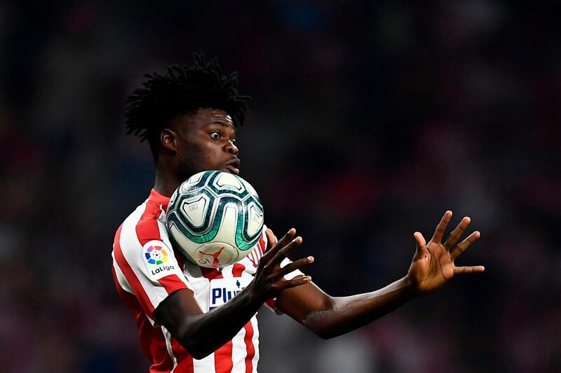 Atletico Madrid's Ghanaian midfielder Thomas Partey jumps for the ball during the Spanish league football match between Club Atletico de Madrid and Real Madrid CF at the Wanda Metropolitano stadium in Madrid on September 28, 2019. / AFP / OSCAR DEL POZO

