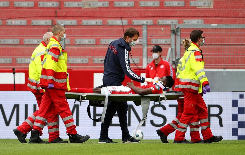 Mainz's Taiwo Awoniyi is carried off after picking up an injury. Reuters