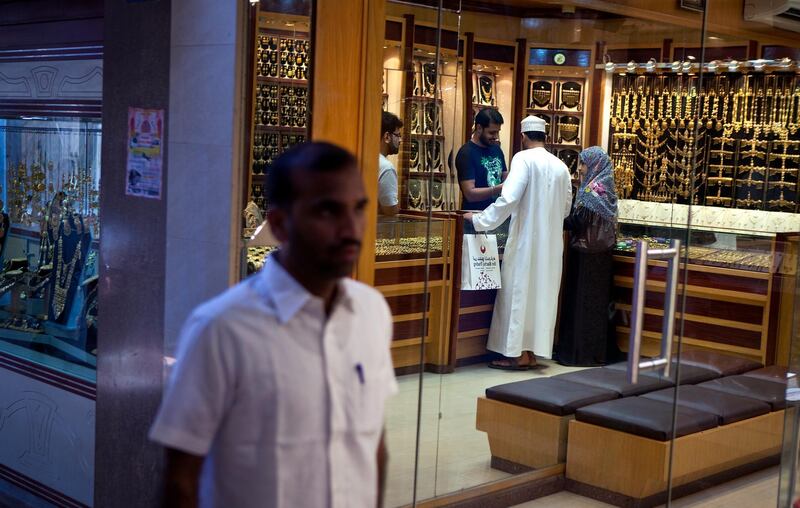 A couple shop for gold jewelry in a store in the historic Mutrah Gould Souk in downtown Muscat, the capital of the Sultanate of Oman on Wednesday, Oct. 12, 2011. (Silvia Razgova / The National)

