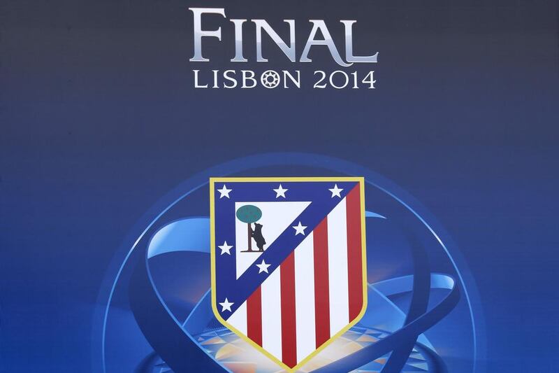 A image of the Champions League final poster featuring Atletico Madrid's crest outside the Estadio da Luz in Lisbon, Portugal on Tuesday. Jose Manuel Ribeiro / AFP / May 20, 2014