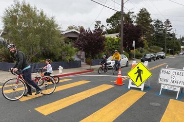 Family biking on Oakland Slow Street at 42nd and Shafter. Courtesy City of Oakland