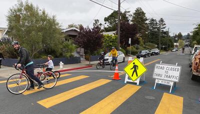 Family biking on Oakland Slow Street at 42nd and Shafter. Courtesy City of Oakland
