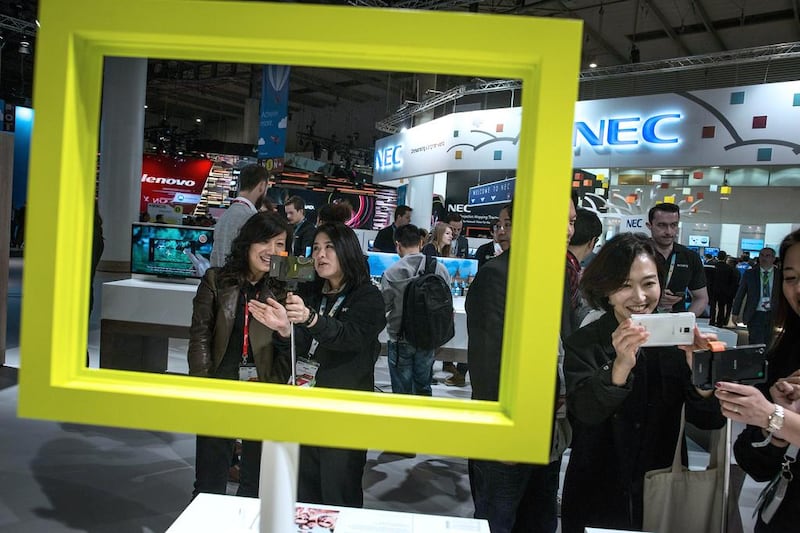 Visitors sample Sony devices during the first day of the Mobile World Congress 2015. David Ramos / Getty Images