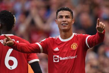 Manchester United's Portuguese striker Cristiano Ronaldo celebrates after scoring their second goal during the English Premier League football match between Manchester United and Newcastle at Old Trafford in Manchester, north west England, on September 11, 2021.  (Photo by Oli SCARFF / AFP) / RESTRICTED TO EDITORIAL USE.  No use with unauthorized audio, video, data, fixture lists, club/league logos or 'live' services.  Online in-match use limited to 120 images.  An additional 40 images may be used in extra time.  No video emulation.  Social media in-match use limited to 120 images.  An additional 40 images may be used in extra time.  No use in betting publications, games or single club/league/player publications.   /  