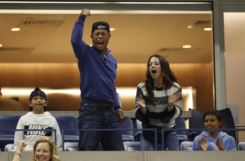 US golfer Tiger Woods reacts as he watches Rafael Nadal of Spain play Marin Cilic of Croatia during their match on the eighth day of the US Open Tennis Championships the USTA National Tennis Center in Flushing Meadows, New York, USA. EPA