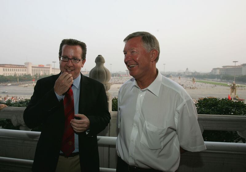 Bryan Glazer chats with Manchester United manager Sir Alex Ferguson in June 2005 during a pre-season tour of China