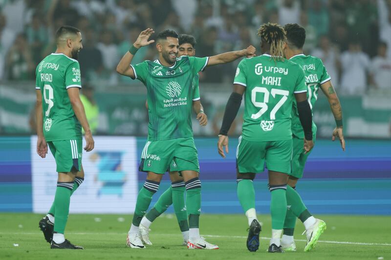 Roberto Firmino of Al Ahli celebrates with teammates after scoring his team's second goal. Getty