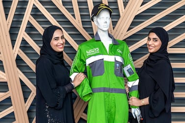 Latifa Al Seiari and Aryam Ahmad show off the cooling suit they designed. Victor Besa / The National 