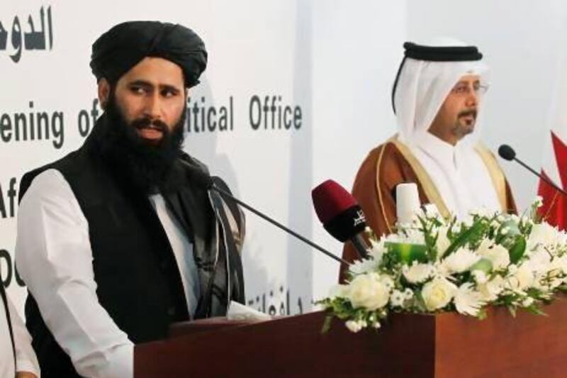 Mohammad Naeem (left), of the Office of the Taliban of Afghanistan, at the opening of the Taliban Afghanistan Political Office in Doha, with Qatari officials.