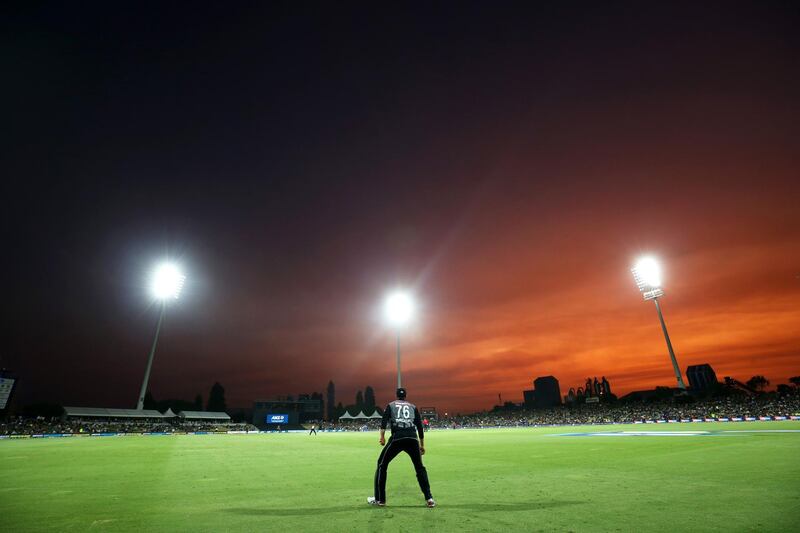 New Zealand fielder Tom Bruce looks on as the sun sets during the fifth Twenty20 international against India at the Bay Oval in Mount Maunganui on Sunday, February 2. AFP