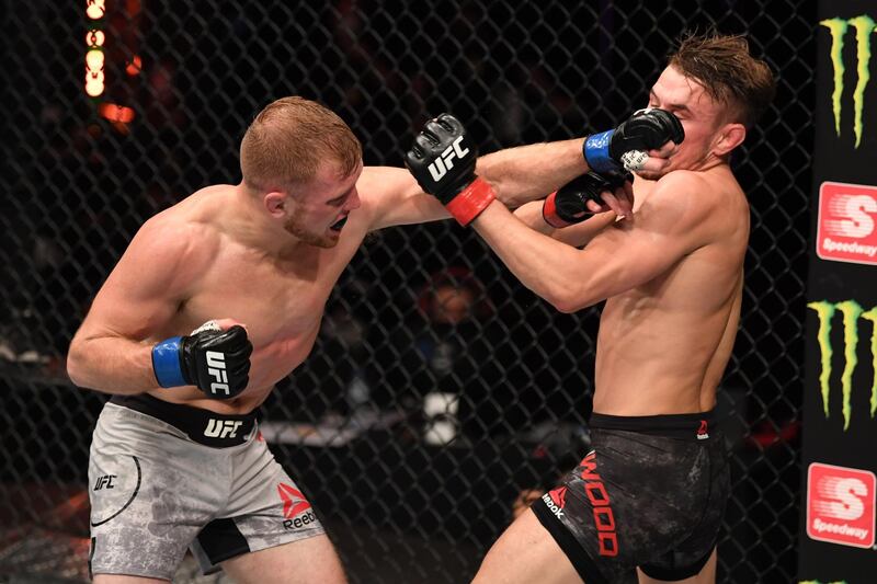 American fighter Casey Kenney lands a punch and his way to victory over Nathaniel Wood of England in their catchweight bout. Getty