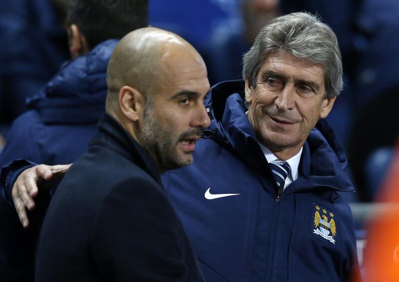 Outgoing Bayern Munich coach Pep Guardiola, left, will take over from Manuel Pellegrini, right, at Manchester City on a three-year deal from the end of the season, the English club announced Monday. (AP Photo/Jon Super, File)
